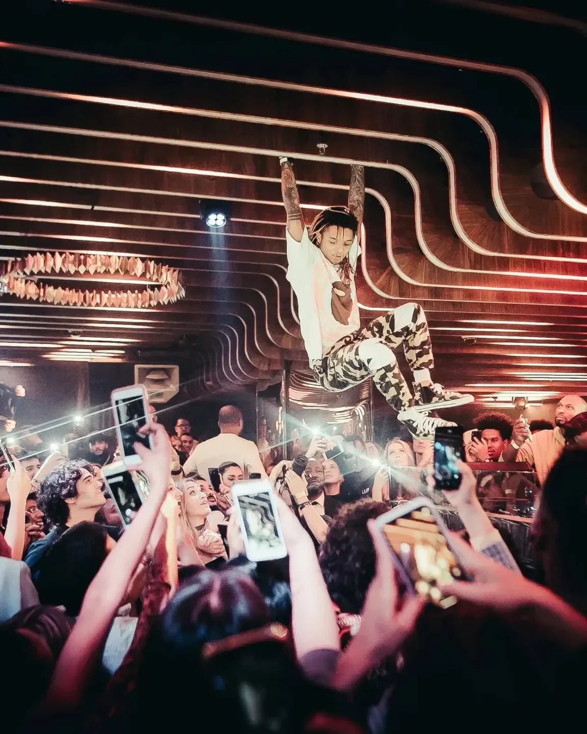 Energetic performance at 1 Oak Dubai nightclub, with audience capturing the moment on their phones.