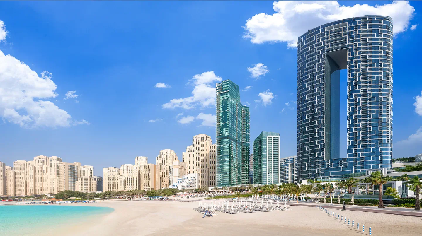 Address Beach Resort Dubai: Stunning beach view with modern architecture and clear blue sky