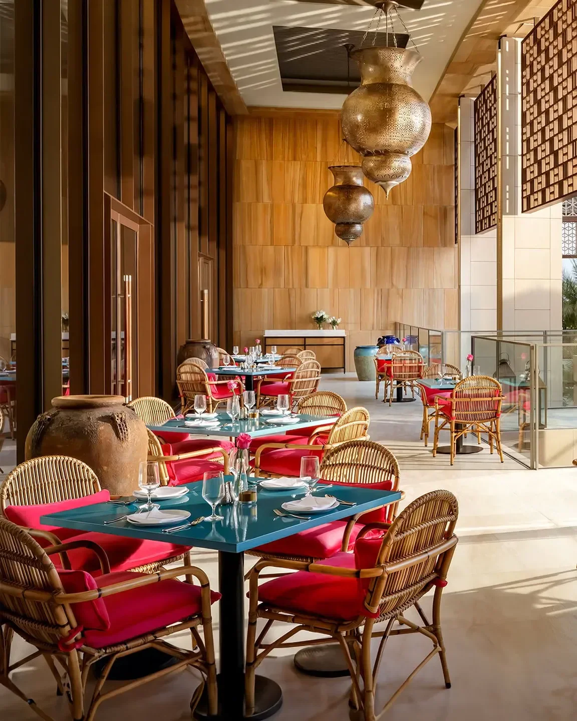 Interior of Ariana's Persian Kitchen in Dubai: tables set for dining, stylish decor.