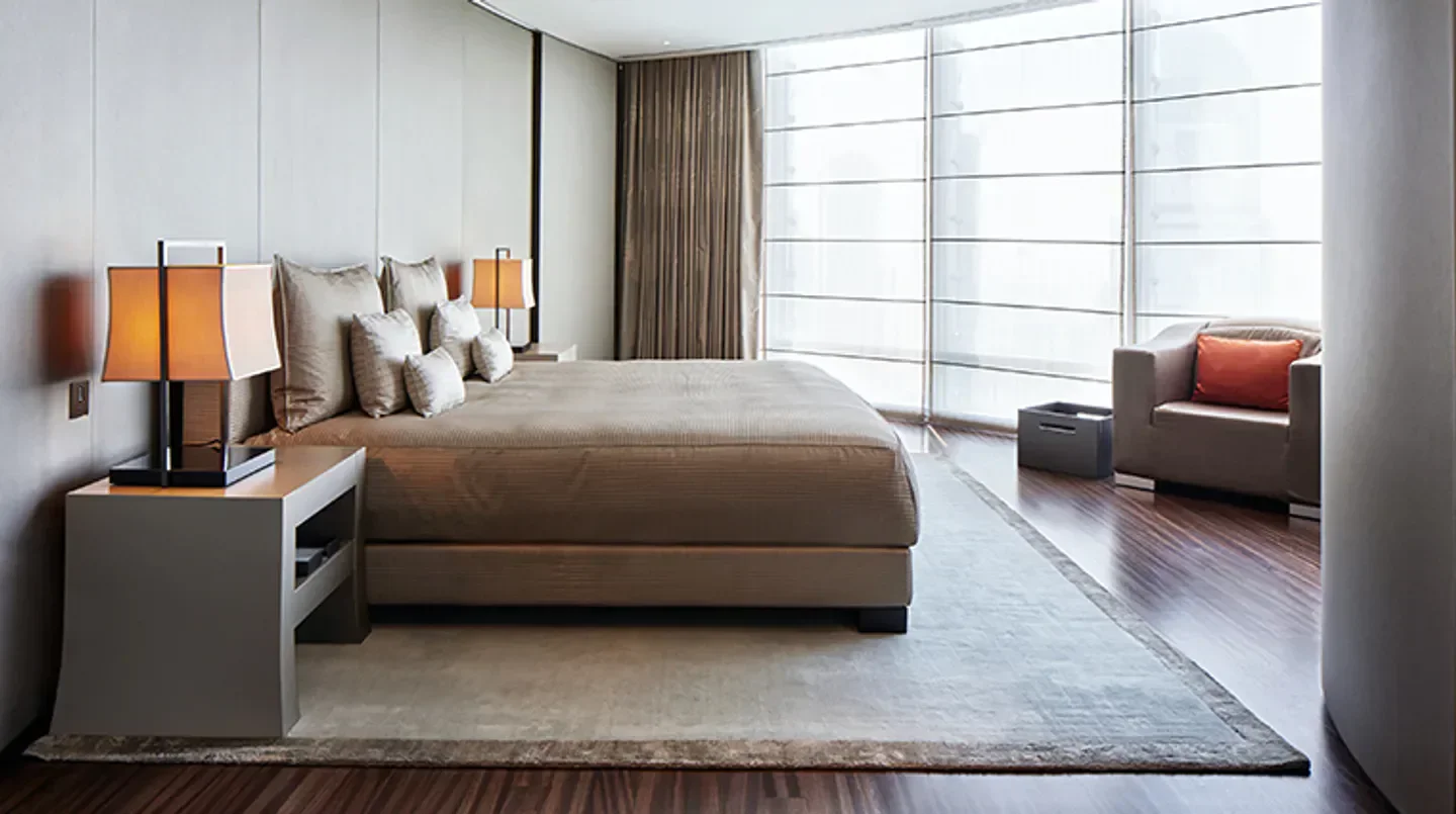 Luxury bedroom interior at Armani Hotel Dubai, Dubai, with cozy bed and seating area