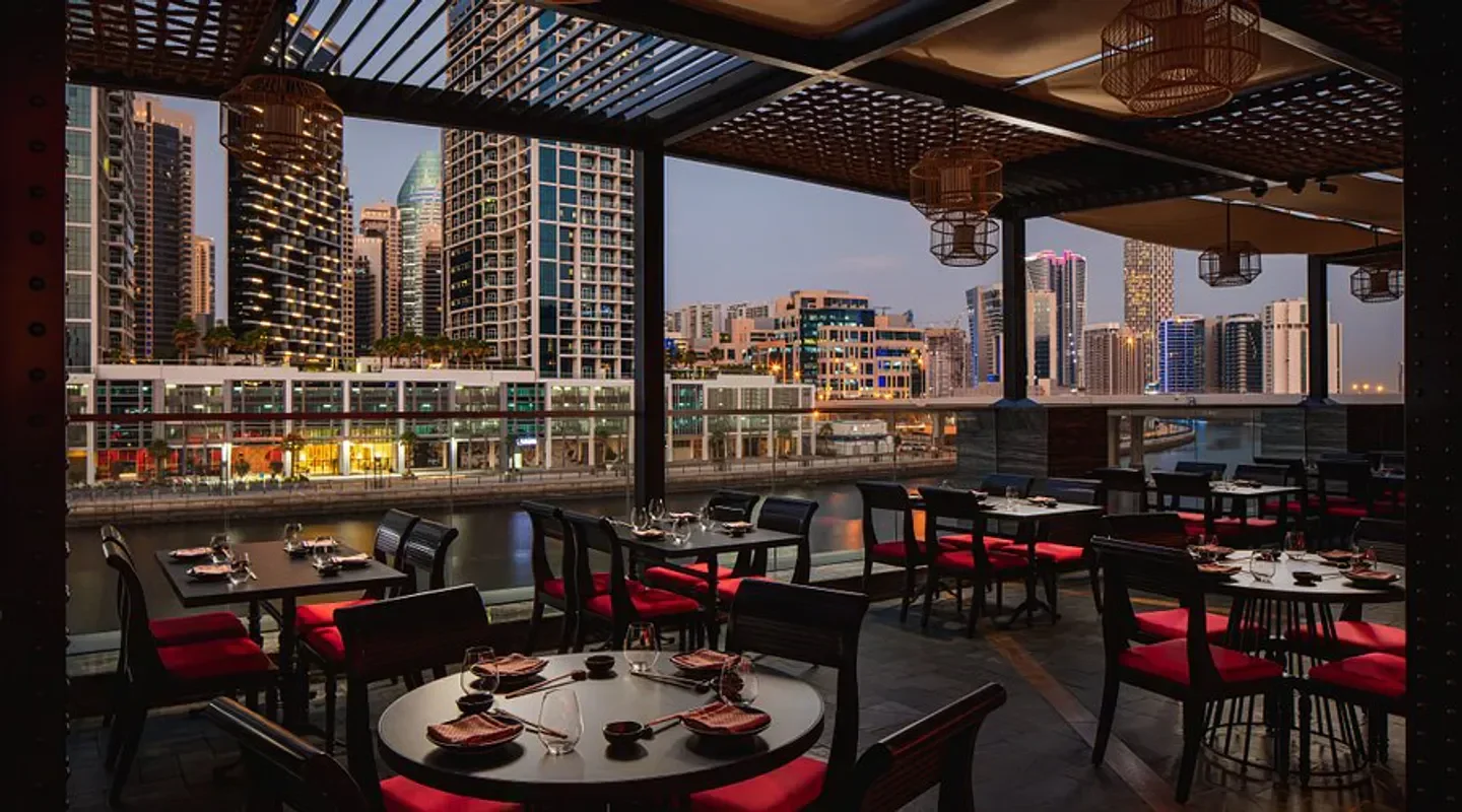 Asia Asia Marina in Dubai with waterfront dining and city views at dusk