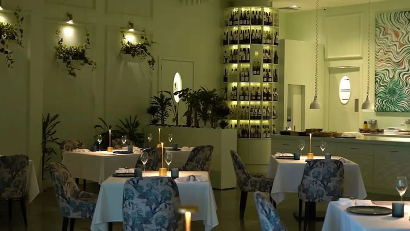 Elegant interior of Avatāra restaurant in Dubai, featuring stylish decor and dining tables