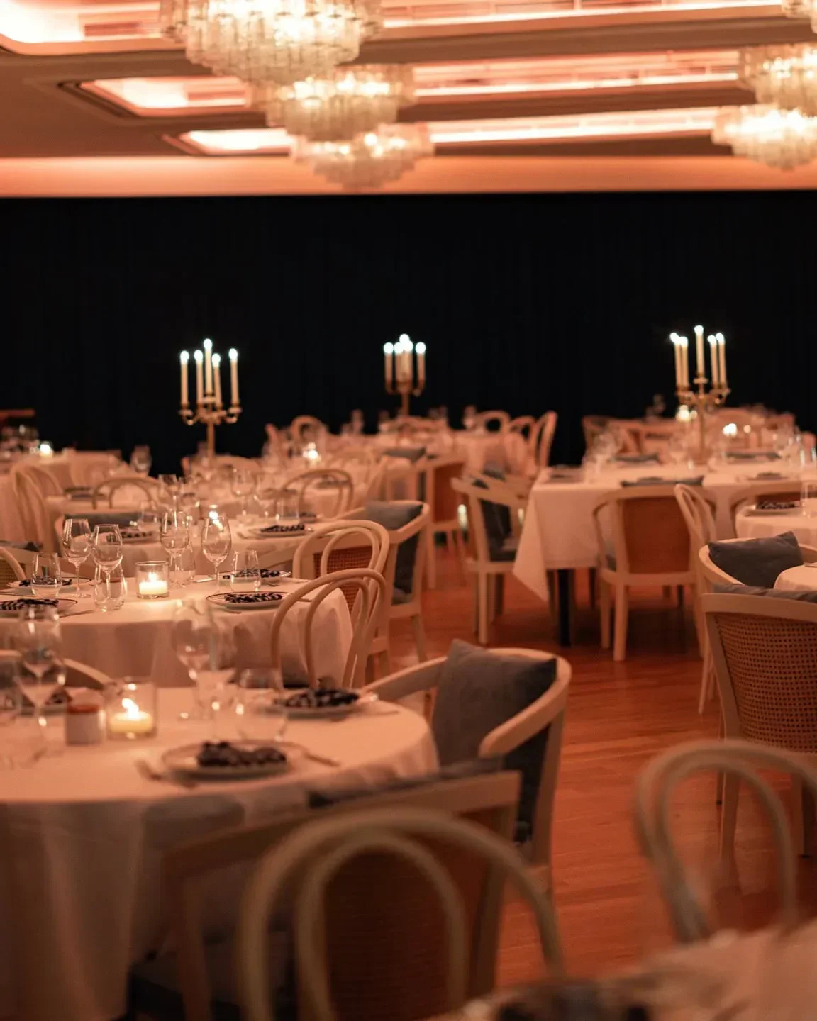 Elegant dining at Bagatelle Dubai, featuring candlelit tables and a sophisticated ambiance.