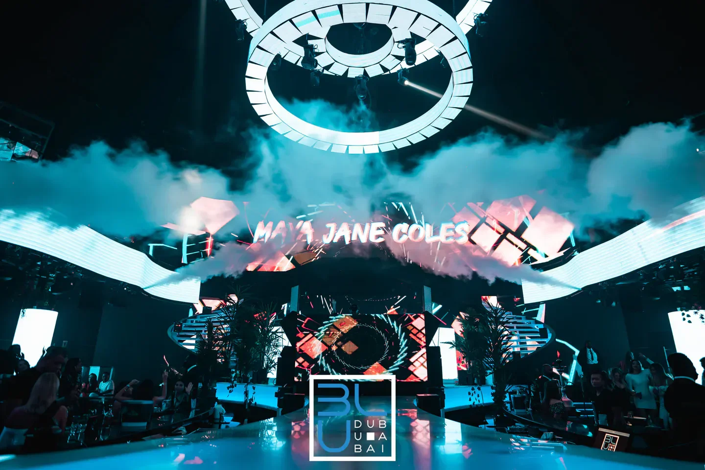 Inside Blu nightclub Dubai, featuring stage lights and smoke, ready for a Maya Jane Coles set.