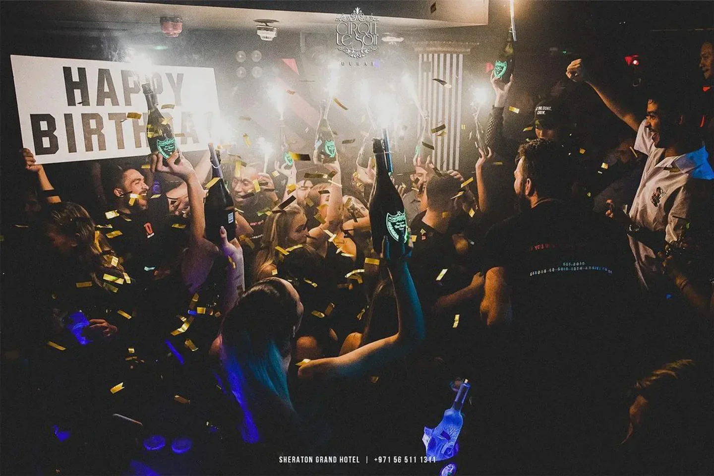 Birthday celebration with champagne at Cirque le Soir Dubai nightclub.