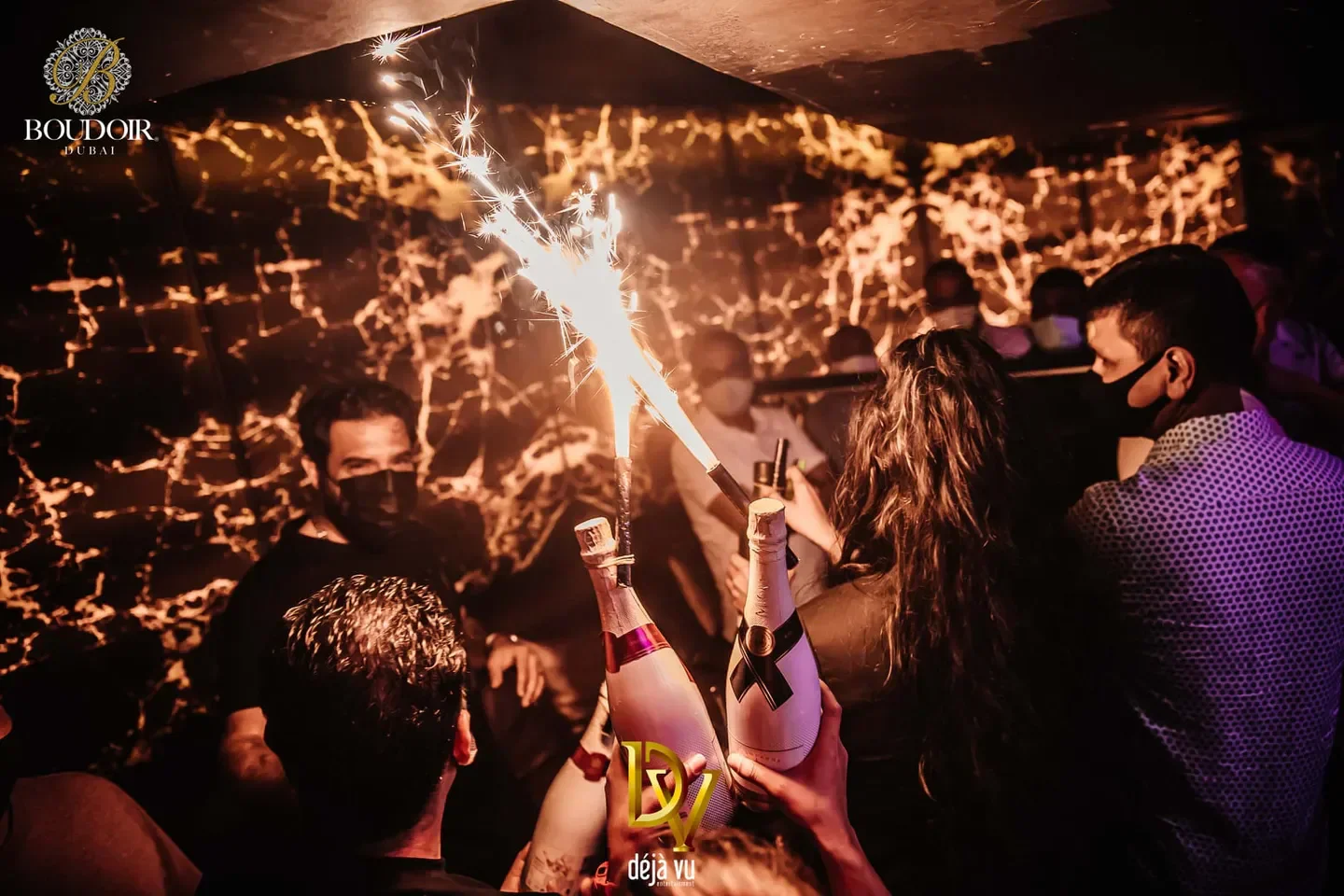 Sparkling champagne at Club Boudoir in Dubai, celebrating with friends and nightlife.