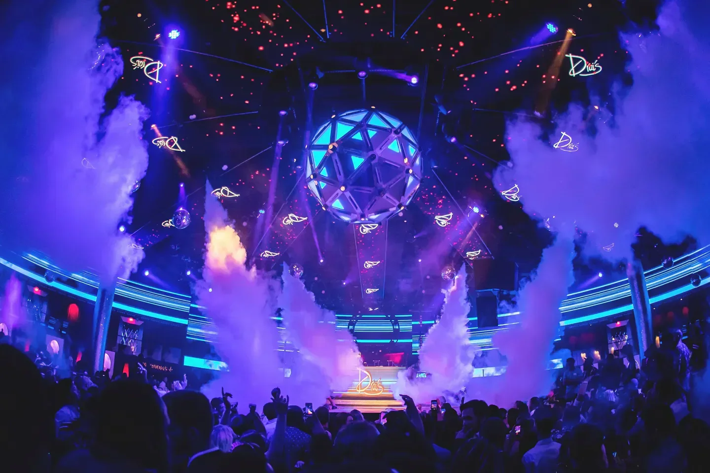 Inside Drai's nightclub in Dubai, with a crowd and impressive lighting display.