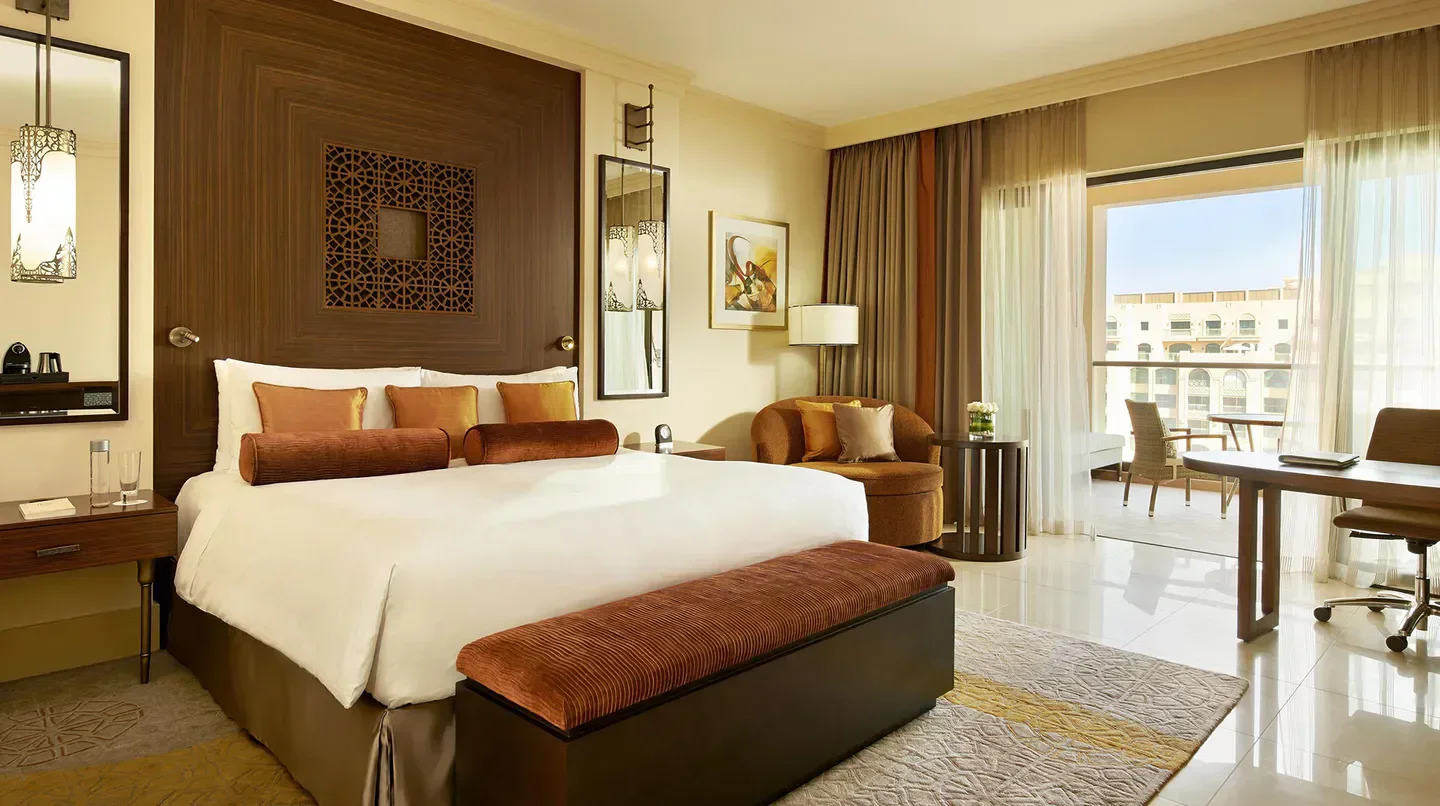 Luxury bedroom at Fairmont The Palm in Dubai with balcony and city view