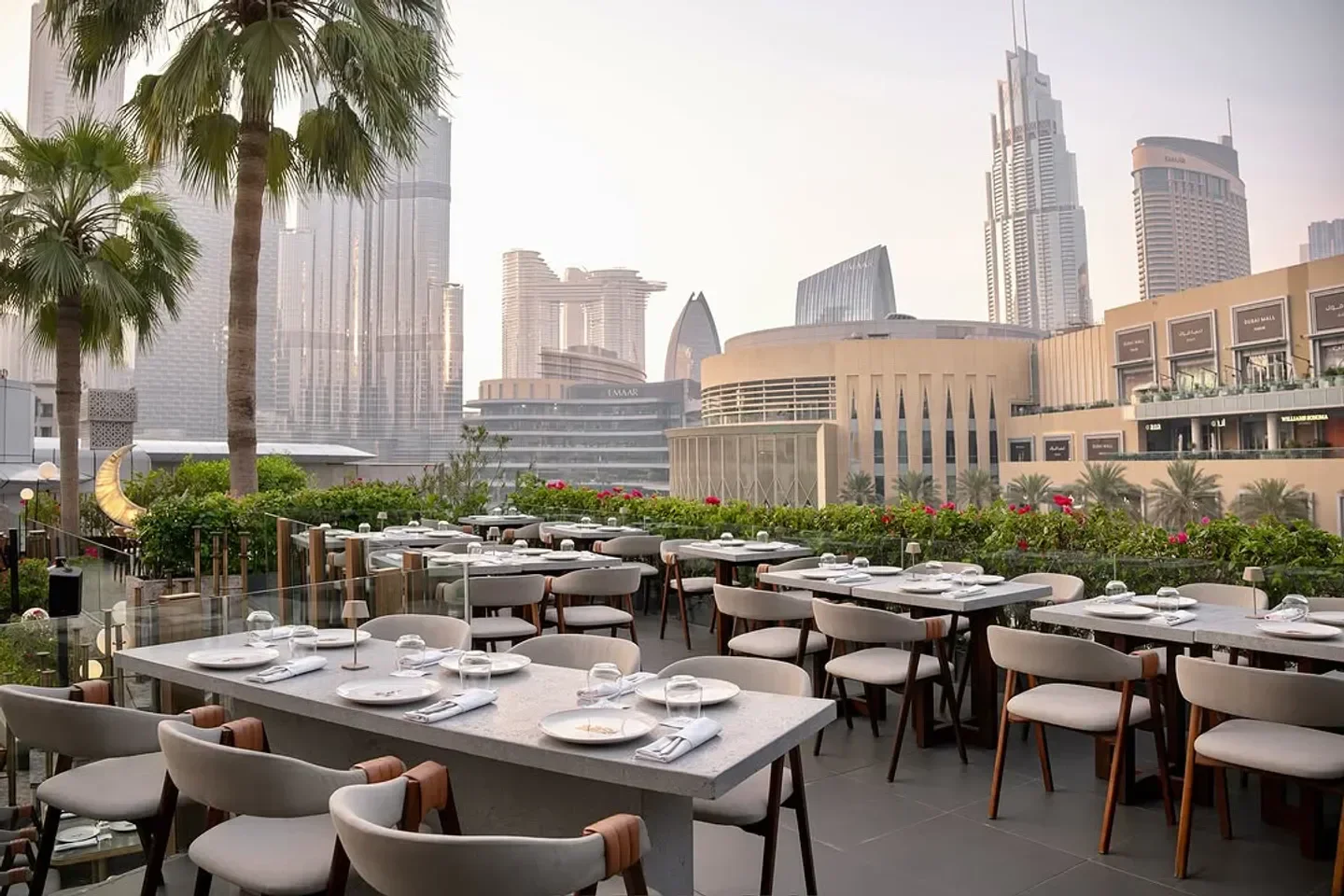 GAL Dubai restaurant with Burj Khalifa views, elegant outdoor dining setting.