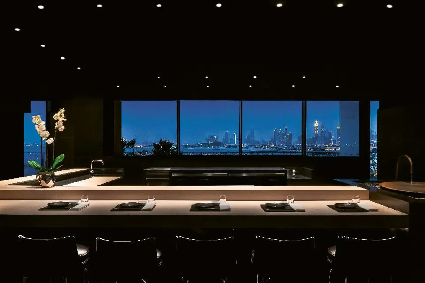 Hōseki Dubai restaurant interior with a stunning view of the city skyline at night