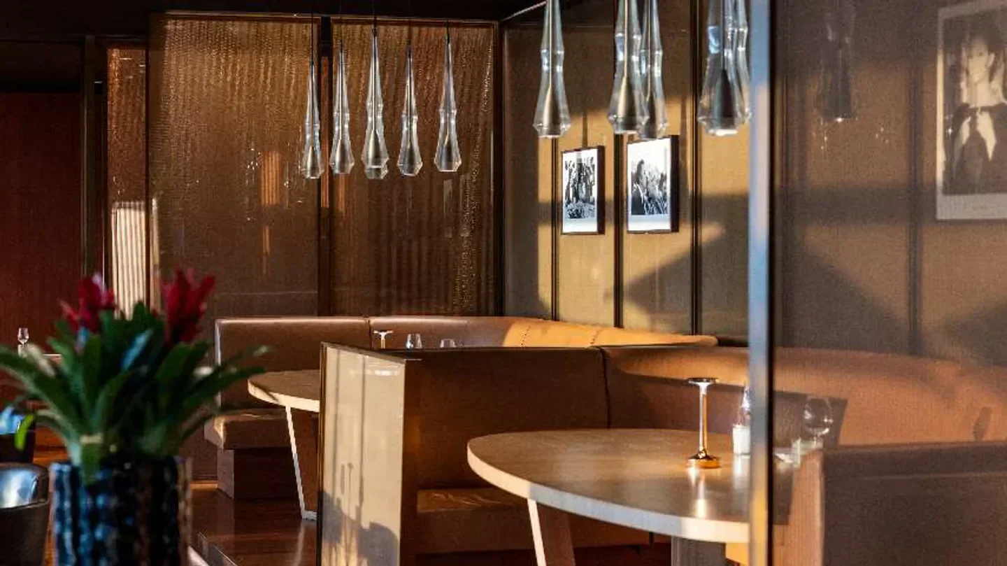 Interior of Il Ristorante Niko Romito in Dubai, featuring elegant design and lighting.