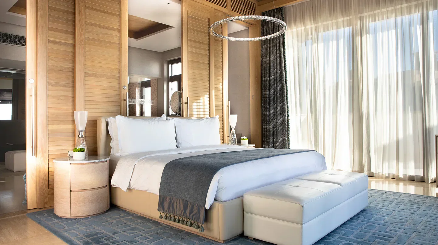 Luxury bedroom at Jumeirah Al Naseem in Dubai, featuring elegant design and natural light.