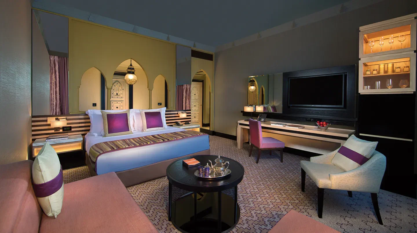 Luxury hotel room interior at Jumeirah Mina A’Salam in Dubai, featuring elegant decor.
