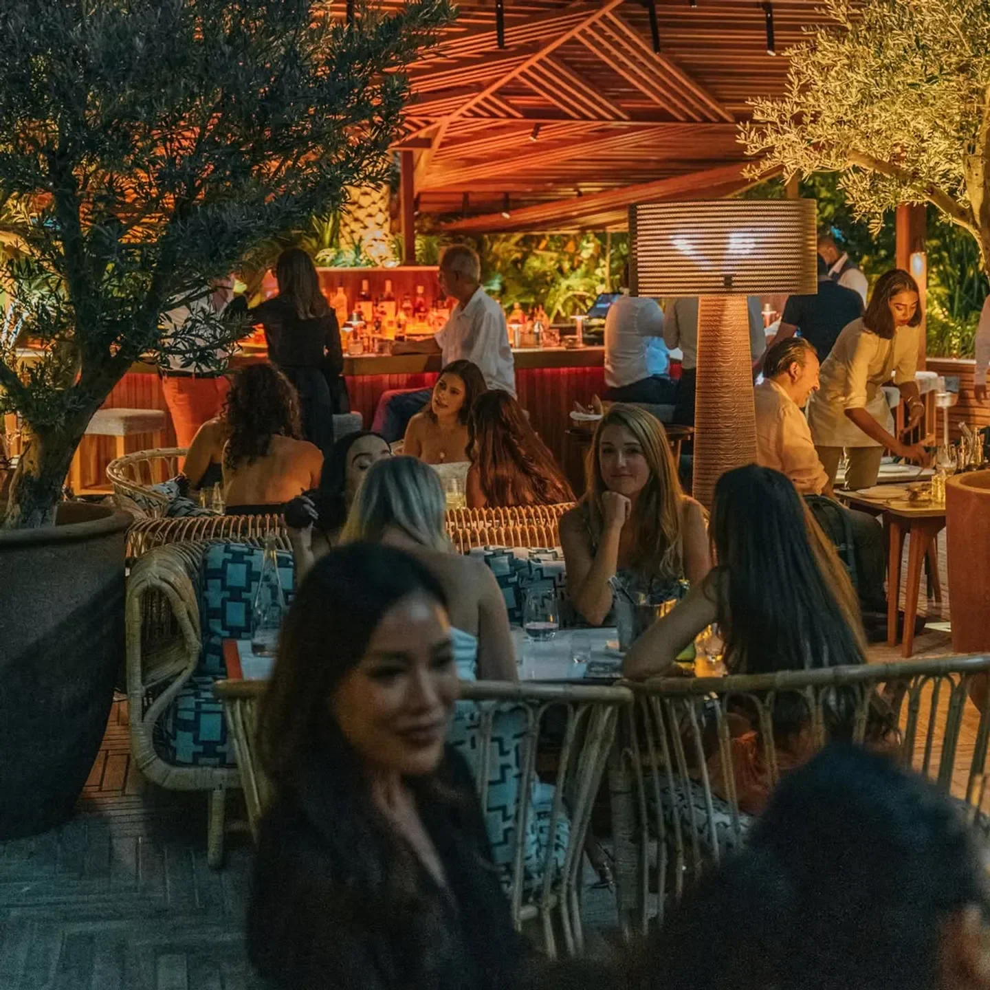 Dining scene at La Cantine de Faubourg Dubai with people enjoying evening.