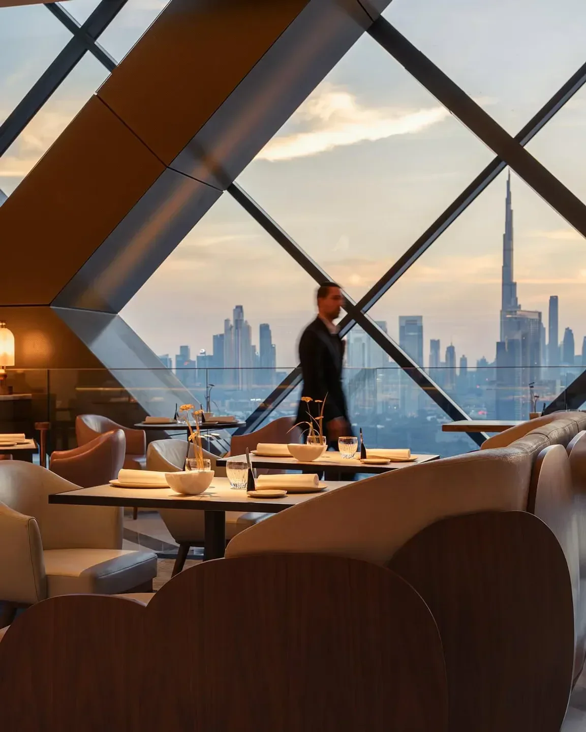 Interior dining view at La Dame de Pic Dubai, with city skyline views.