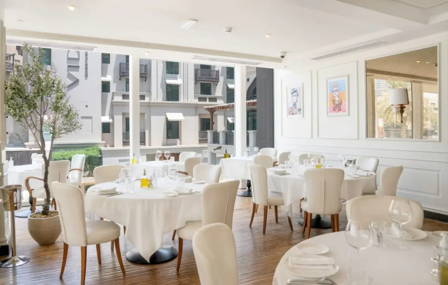 Elegant dining room at La Serre restaurant in Dubai, with a bright and airy atmosphere.