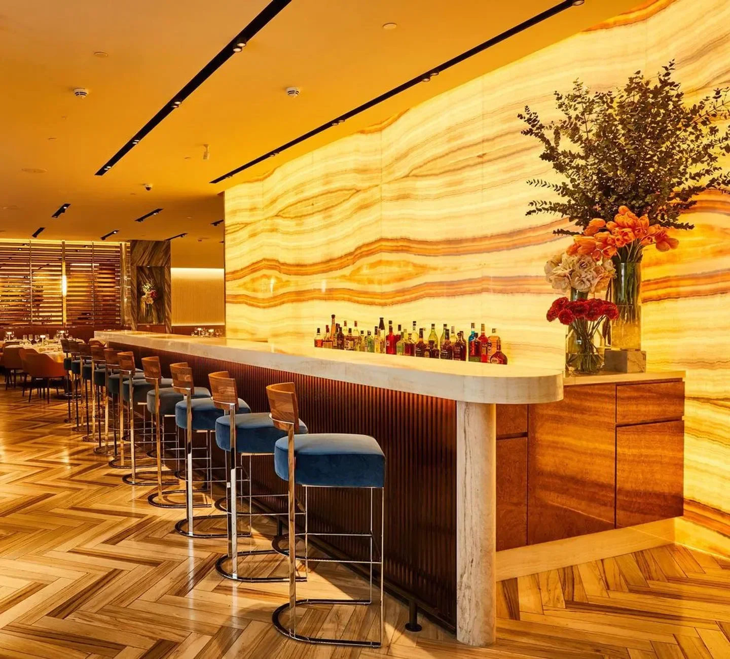 Stylish bar interior with warm lighting at Marea Dubai restaurant.