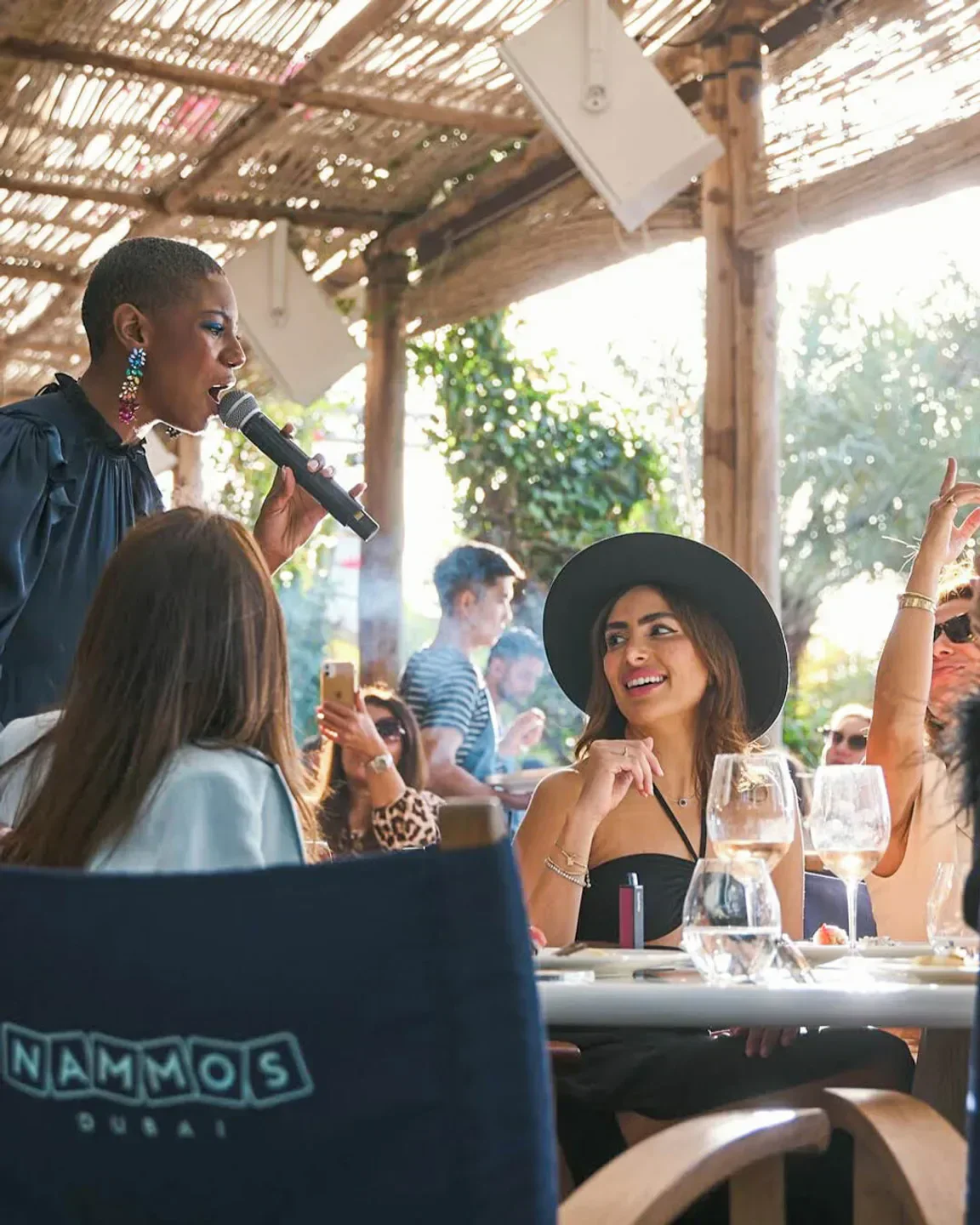 Live music at Nammos Dubai beach club with people enjoying the show