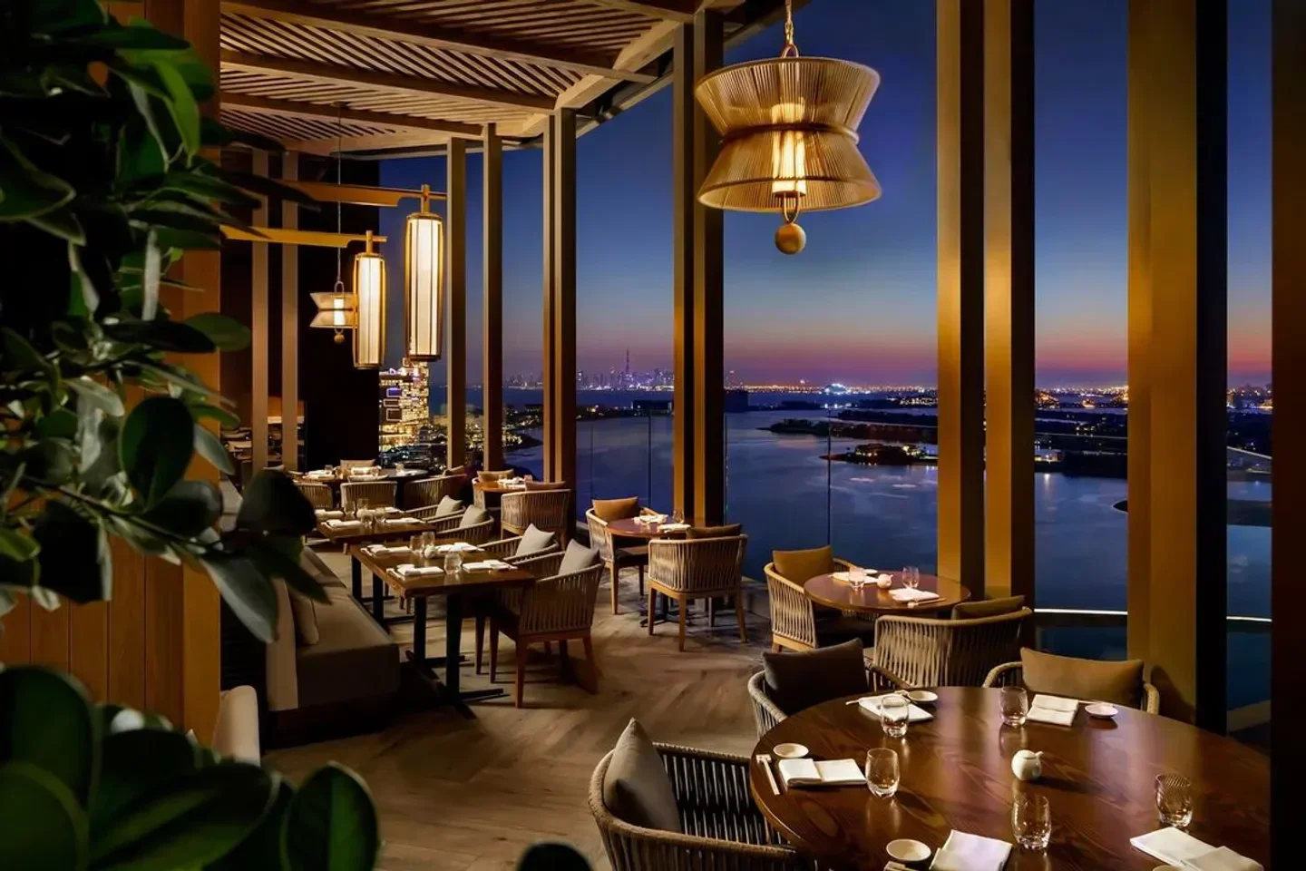 Nobu Dubai restaurant interior with a stunning view of the city at dusk