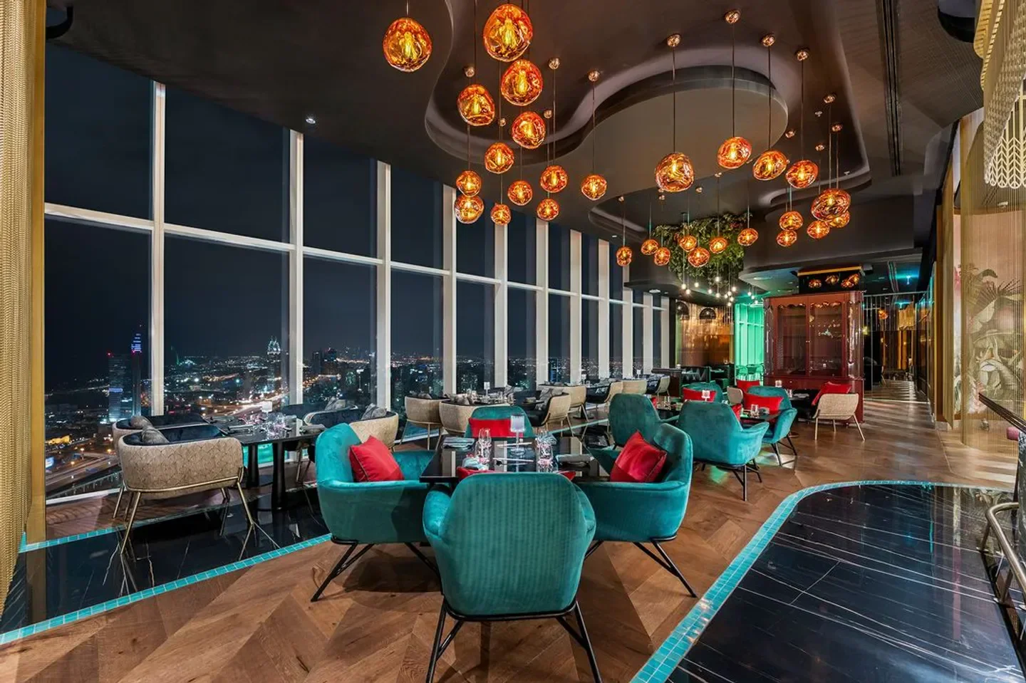 Elegant dining area at Nonya Dubai with stunning city night views and stylish decor.