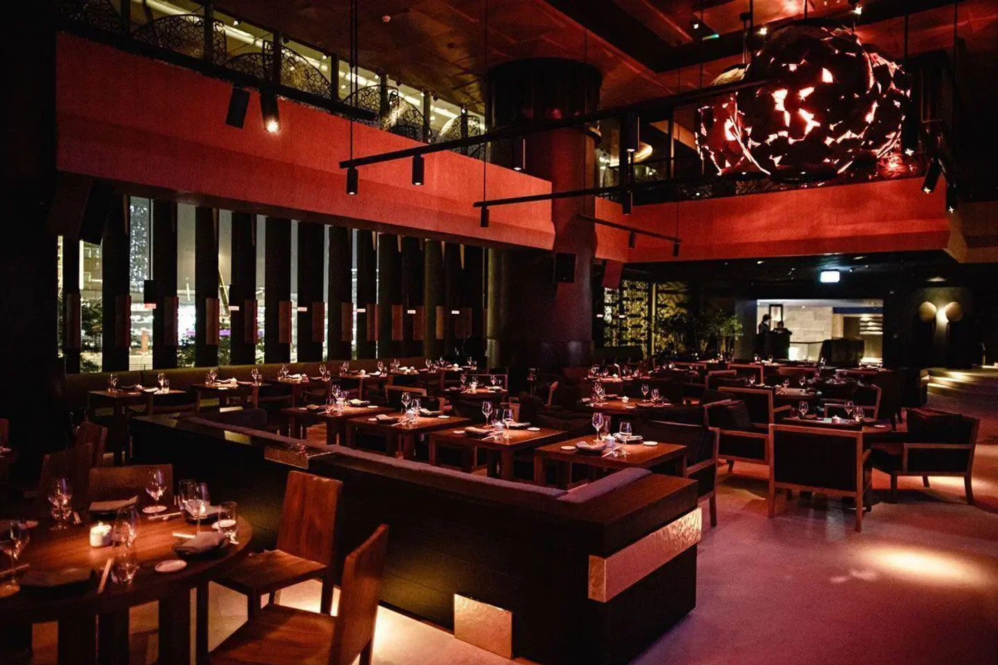 Elegant interior dining space at Novikov Dubai with warm lighting and stylish tables.