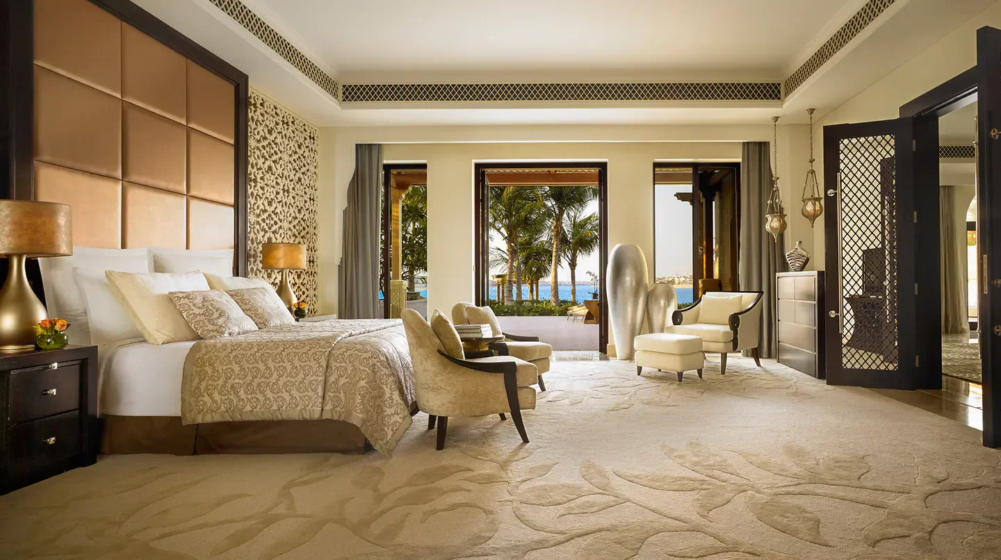 Luxurious bedroom suite at One&Only The Palm in Dubai, featuring ocean views.