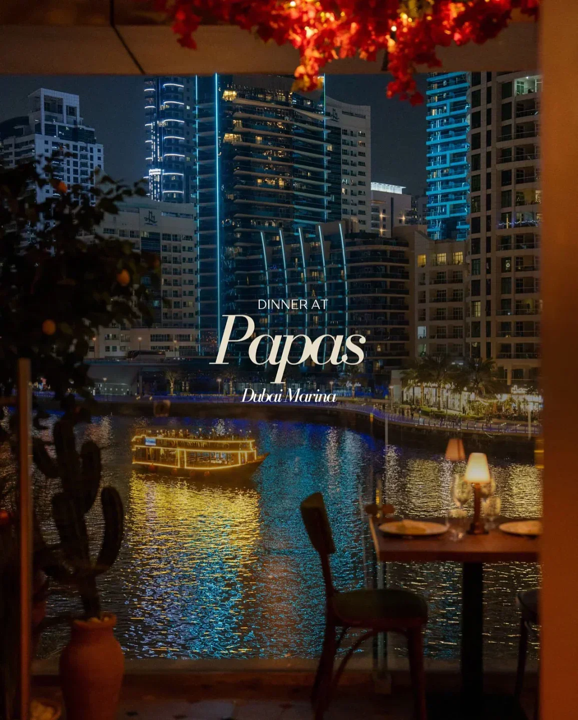 Dinner at Papa Dubai's restaurant overlooking the Dubai Marina at night with city views