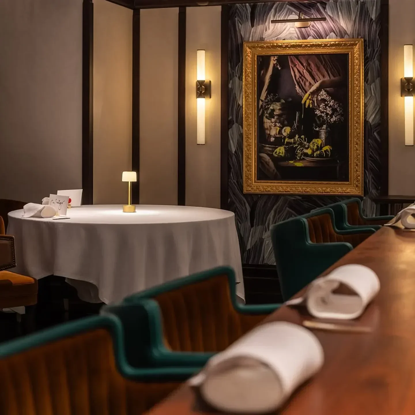 Elegant interior of Row on 45 restaurant in Dubai, featuring artwork and cozy seating.