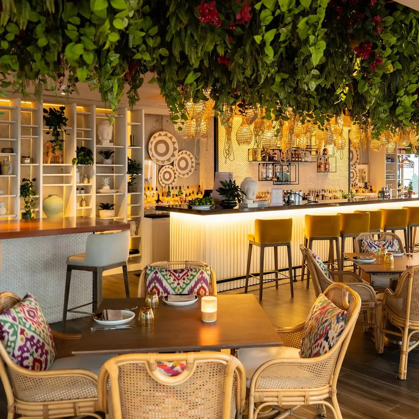 Stylish interior of Siddharta Lounge Dubai with lush greenery and elegant bar.