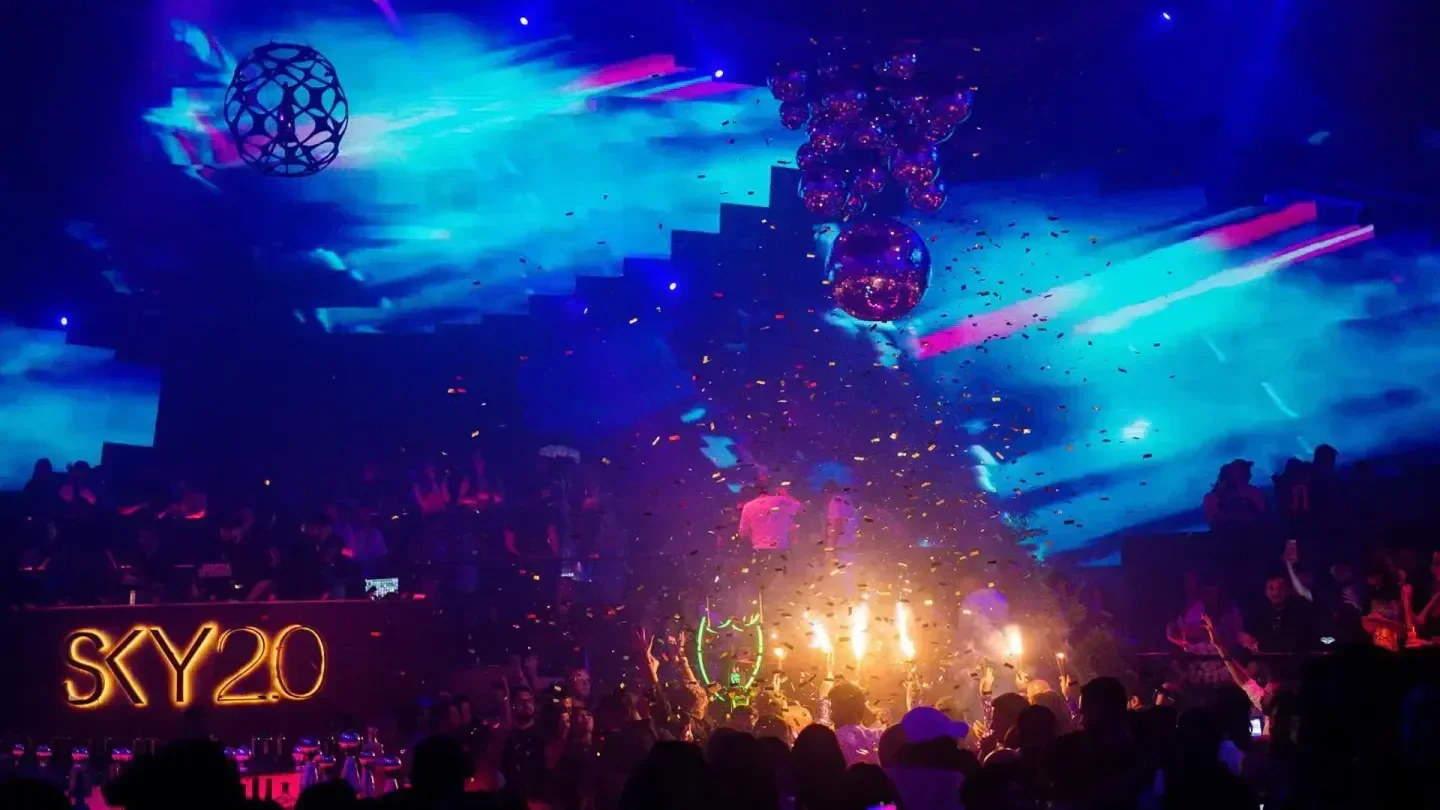 Energetic nightclub scene at Sky 2.0 in Dubai with confetti and vibrant lighting