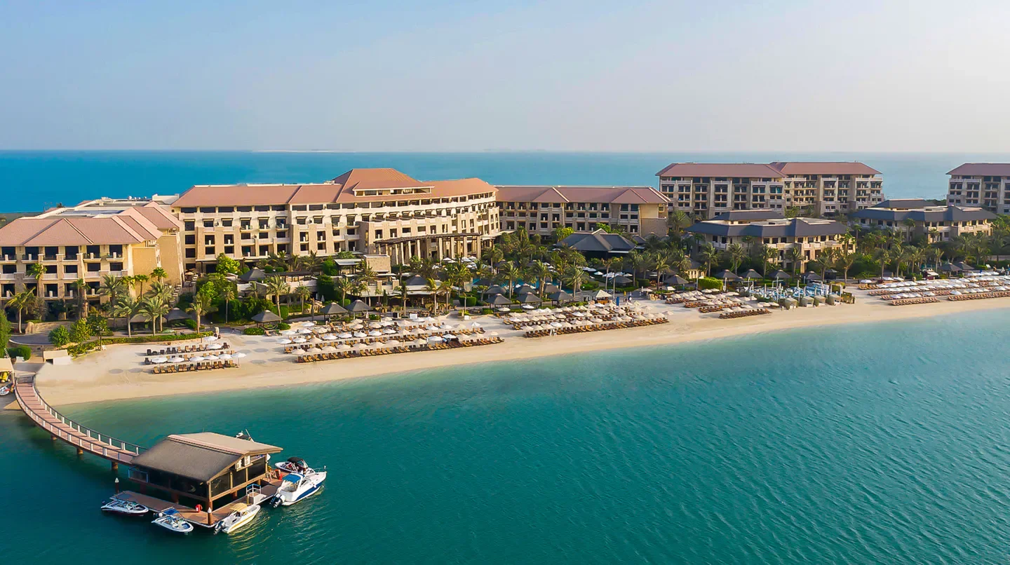 Aerial view of Sofitel Dubai The Palm beach resort and turquoise waters in Dubai