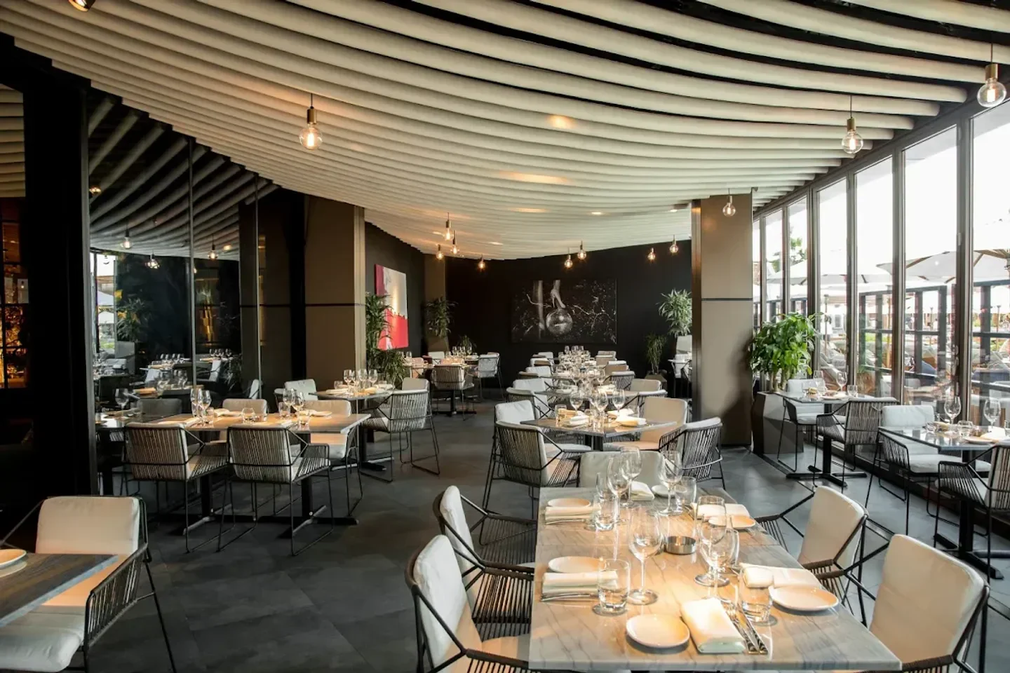 Stylish interior dining at STK JBR restaurant in Dubai, featuring elegant seating and decor.