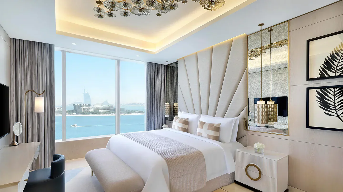 Elegant bedroom with water views at The St. Regis Dubai, The Palm in Dubai.
