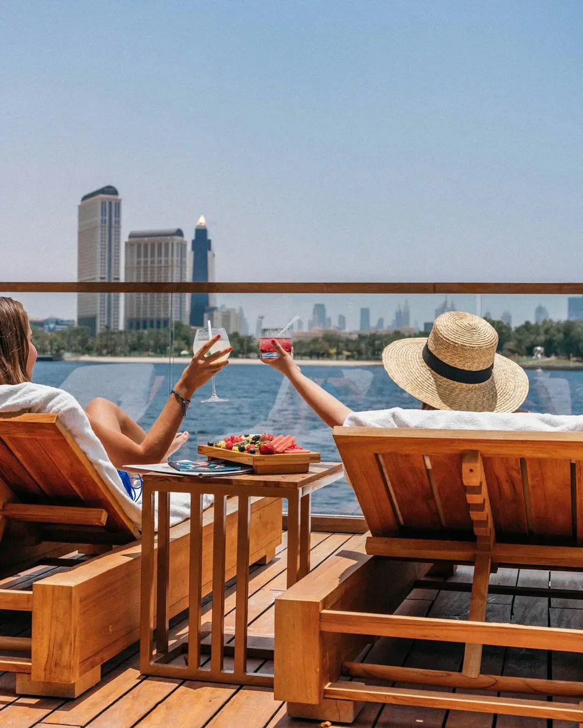 Enjoying cocktails at Twiggy Beach Club in Dubai with city views and sunshine.