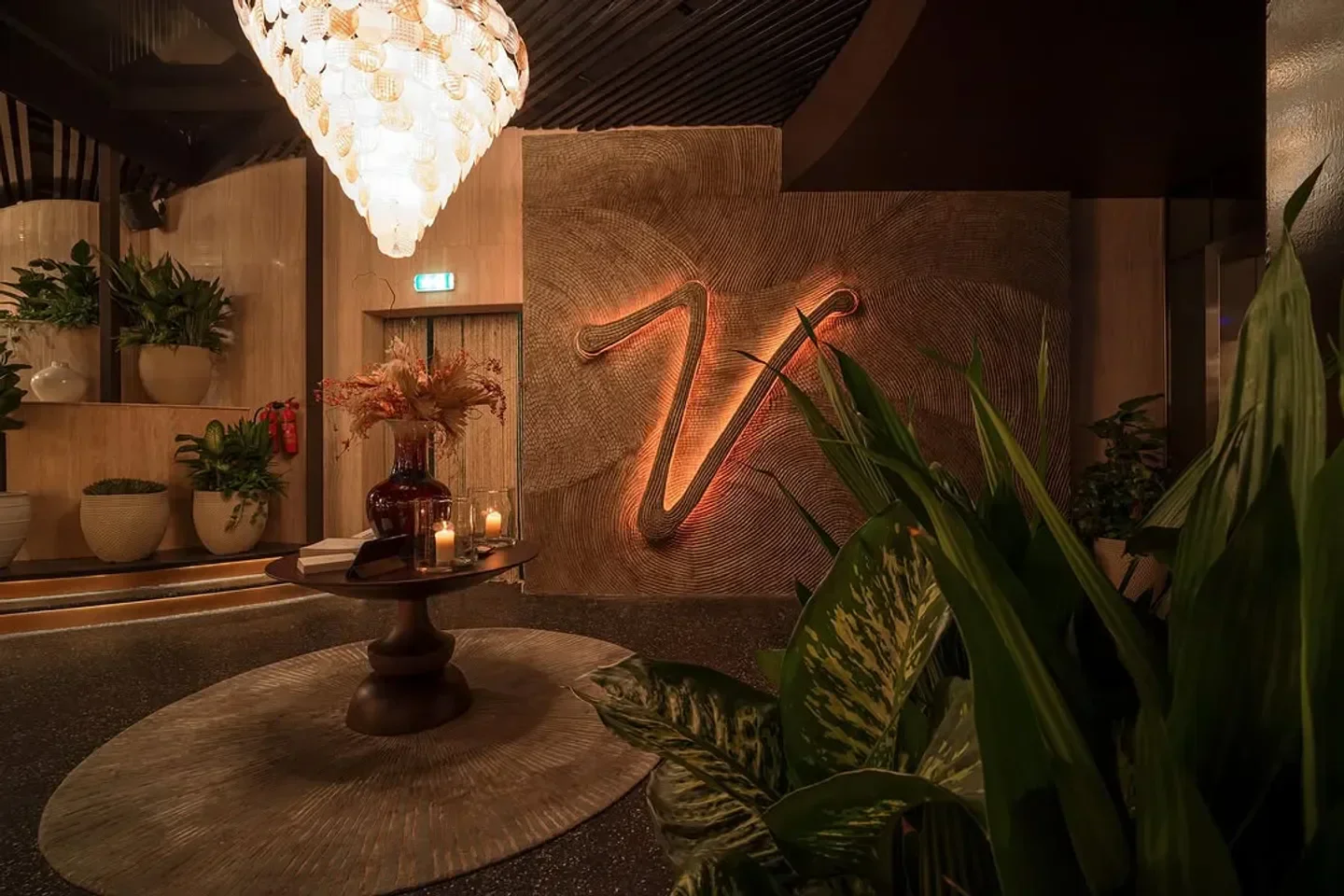 Interior of Verde Dubai restaurant, featuring stylish decor and lush greenery.