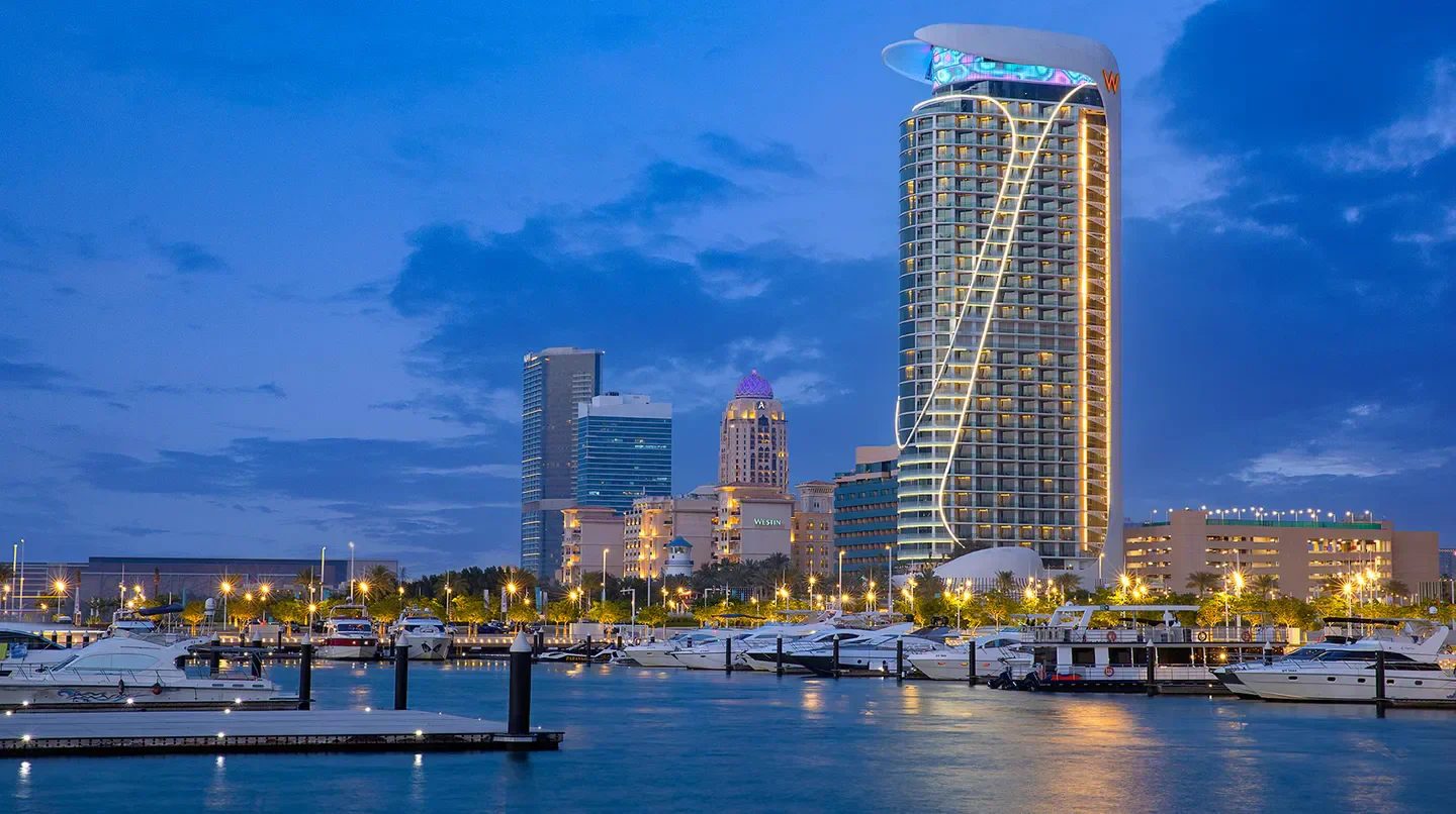 W Dubai - Mina Seyahi overlooking Dubai marina at dusk with boats and skyline views.