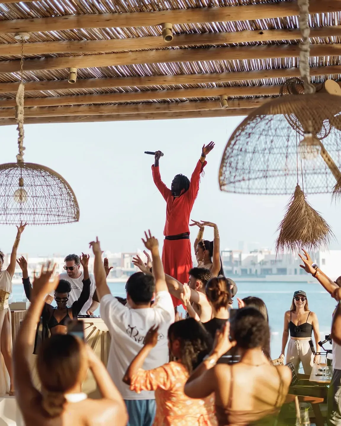 Energetic crowd enjoying live music at White Beach Club in Dubai with stunning views